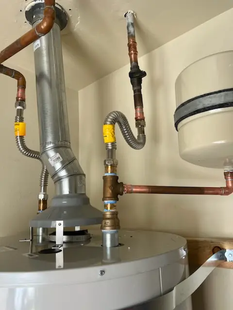 Water heater installation and plumbing repair in Fenwick